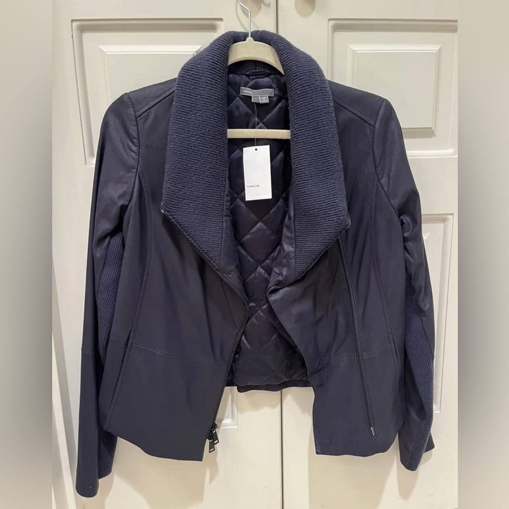 NWT Perfect condition. Small, navy blue. Purchased for $995. 100% goat leather.